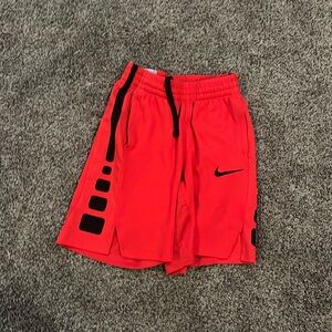 Red Nike shorts